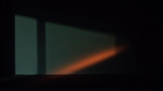 Shadow play with light in a dark room at dusk photo
