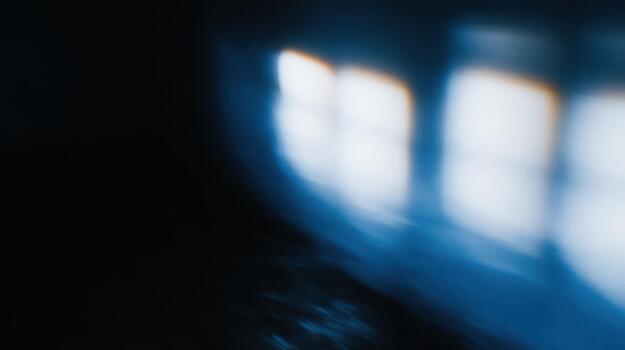 Blurred reflections of light in a dark room photo