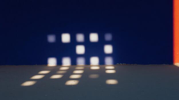 Shadows formed by sunlight create patterns on the ground photo