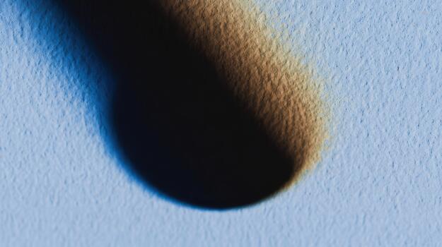 Shadow on textured surface creates visual contrast photo