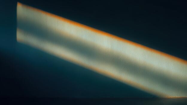 Light beam casting shadows on a textured wall photo