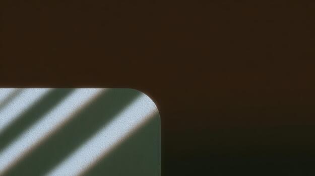 Soft shadows create patterns on a table edge photo