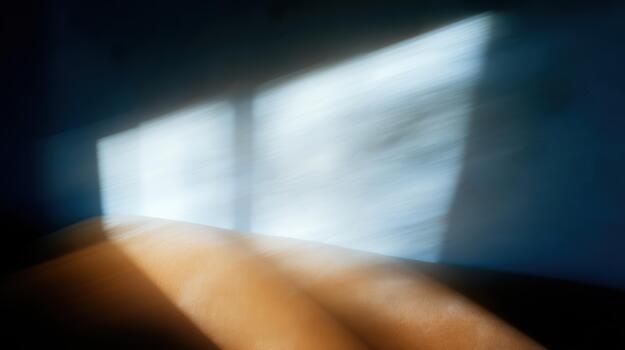 Soft light casts shadows in a quiet room photo