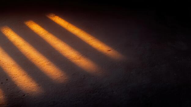 Shadows cast by sunlight on a textured surface photo