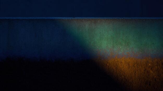 Colorful light patterns on a textured wall at night photo