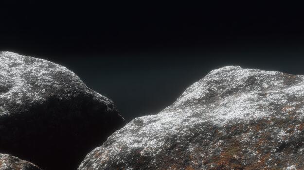 Close-up view of textured rocks in low light setting photo