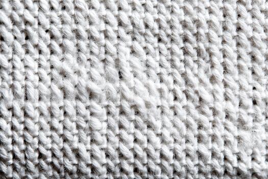 Textured white knit fabric showing intricate patterns photo