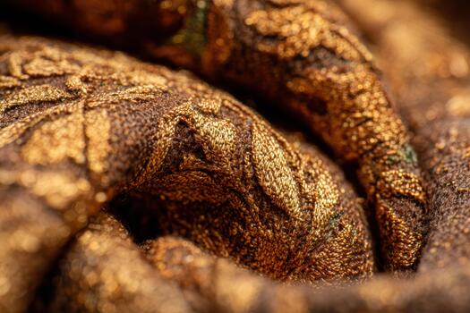 Close-up view of ornate fabric with gold details photo