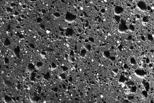 Volcanic rock texture with porous surface photo