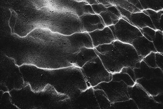 Beautiful patterns on a sandy beach at sunset photo