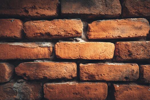 Textured red bricks stacked in a wall with rustic charm photo