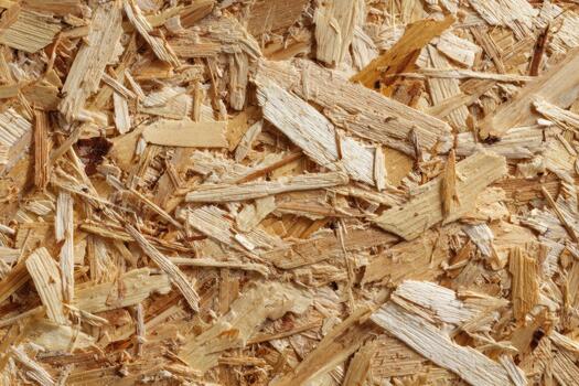 Wood chips spread out in a textured pattern on surface photo