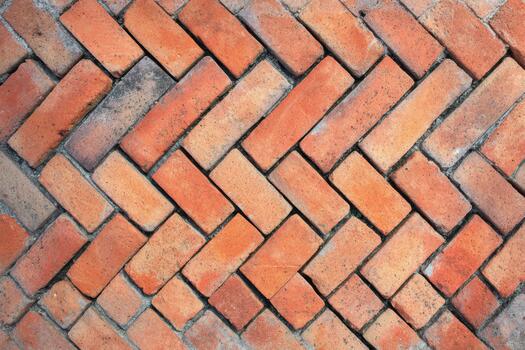 Colorful herringbone pattern made of red bricks photo