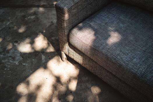 Sofas and shadows in a calm outdoor setting photo