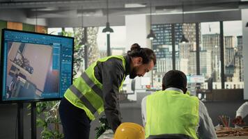 Property developers and architects in business meeting reviewing blueprints and structural designs. Team discusses project approval, redevelopment and city planning for housing growth. Camera B. video