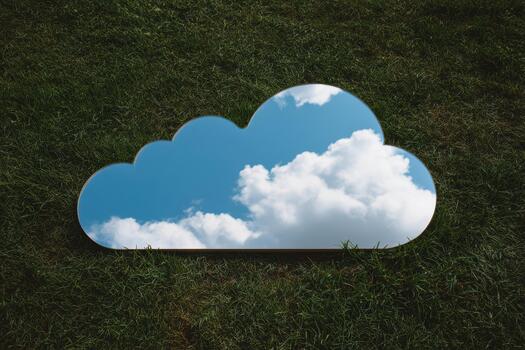 Reflection of clouds on a grassy surface in summer photo