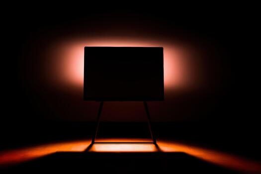 Mysterious silhouette on an easel in low light photo