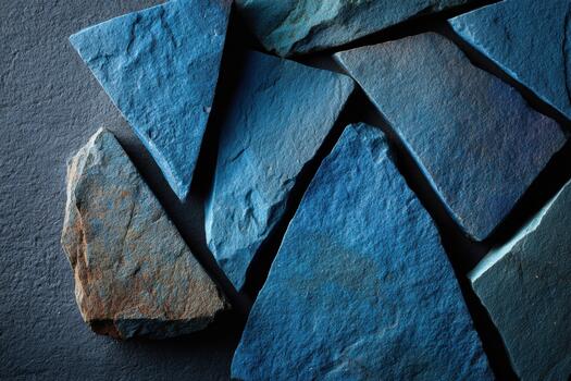 Collection of blue slate stones arranged in pattern photo