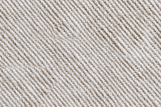 Textured fabric in light beige color with a subtle pattern photo