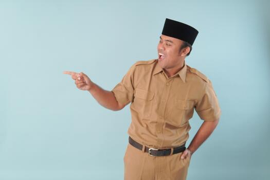 government worker with khaki uniform giving gesturing pointing at the, copy space a picture PNS, ASN civil servant concept. photo