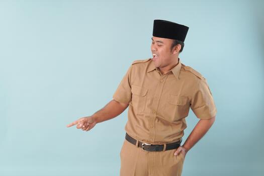 government worker with khaki uniform giving gesturing pointing at the copy, space a picture PNS, ASN civil servant concept. photo