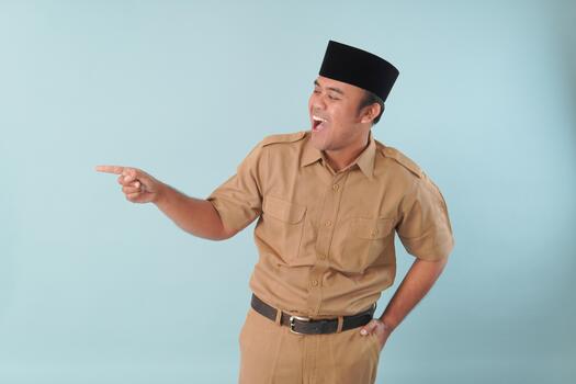 government worker with khaki uniform giving gesturing pointing at the copy space, a picture PNS, ASN civil servant concept, photo