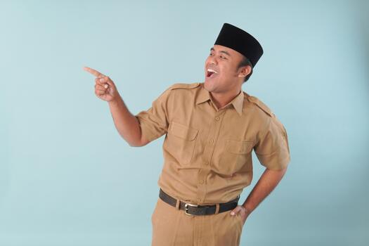 government worker with khaki uniform giving gesturing pointing at the copy space, a picture PNS, ASN civil servant concept. photo