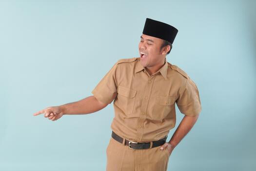 government worker with khaki uniform giving gesturing pointing at the copy space a, picture PNS, ASN civil servant concept, photo