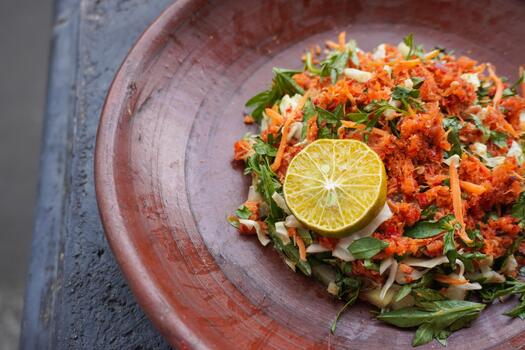 Trancam is a traditional salad from Java, Indonesia made from fresh vegetables such as cucumber, and white cabbage, which are cut into pieces and mixed with grated coconut with spices. photo