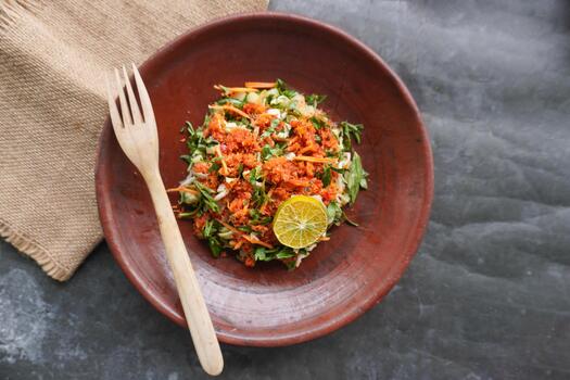 Trancam is a traditional salad from Java. Indonesia made from fresh vegetables such as cucumber, basil and white cabbage, which are cut into pieces and mixed with grated coconut with spices. photo