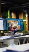 vertical Inovativa escritório apresentando dual monitores corrida avançado 3d Renderização programas para interior Projeto e construção planejamento. digital área de trabalho construído para criatividade e projeto gerenciamento. video