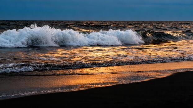 Crashing ocean wave illuminates dark water surface near a wet shore at twilight photo