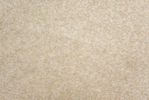 Beige felt texture background. Soft fabric surface with fuzzy fibers, warm neutral textile material for design or craft backdrop. photo