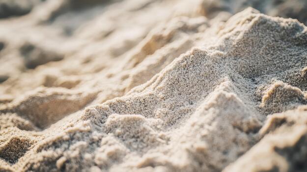 Closeup of Texture and Pattern of Sand on Sandy Ground at Beach photo