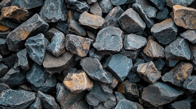 pila de oscuro gris y ligero marrón rocas creando un rock antecedentes foto