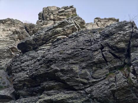 solid stone layers, distinctive jagged stone faces displaying sedimentary layer patterns and geology photo