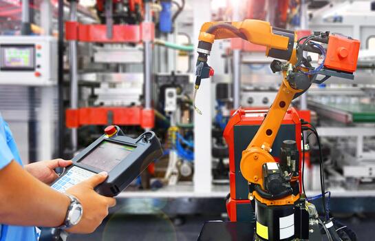 Engineer check and control automation Modern Robot system in factory photo