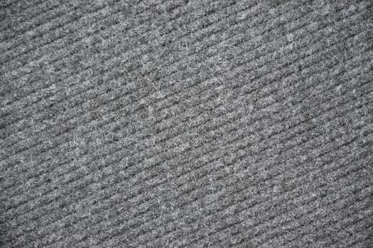 A close up of a gray carpet with a pattern photo