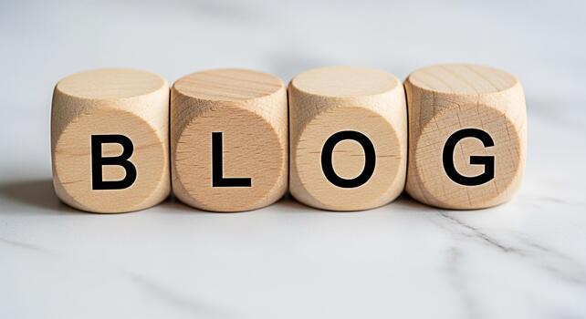 Wooden blocks spelling BLOG on a marble surface representing online content creation and digital marketing strategies in a modern minimalist setting conveying a sense of information and connection photo