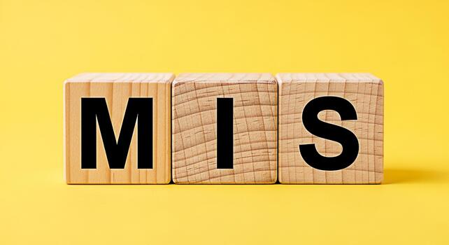 Wooden blocks spelling MIS on a bright yellow background representing management information systems business strategy and data analysis for effective decisionmaking and organizational success photo