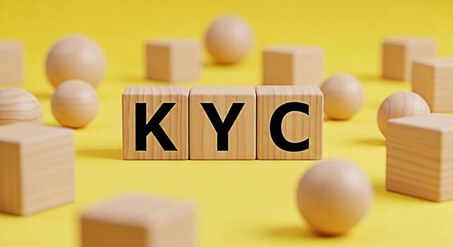 KYC letters displayed on wooden blocks amidst geometric shapes against a vibrant yellow backdrop symbolizing identity verification and regulatory compliance in a modern and minimalist setting photo