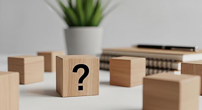 Wooden blocks displaying a question mark on a bright desk symbolizing uncertainty and problemsolving in a minimalist office setting fostering a mood of inquiry and intellectual challenge photo