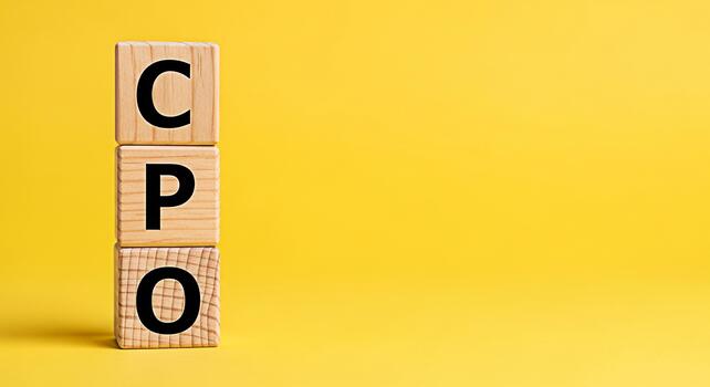Wooden blocks spelling CPO stacked on a yellow background representing cost per order a key performance indicator in digital marketing and ecommerce conveying efficiency and optimization photo