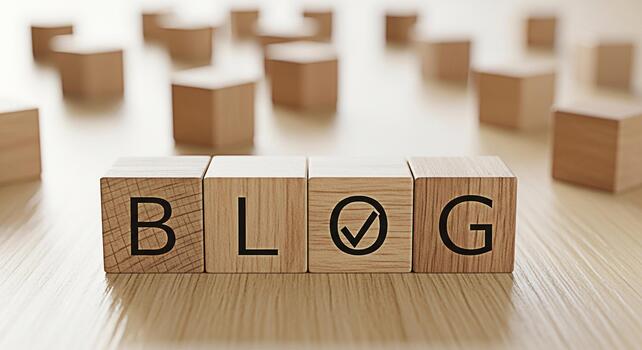 Wooden blocks spelling out BLOG with a checkmark in a bright studio setting representing successful blogging online content creation and the importance of verification and quality in digital media photo