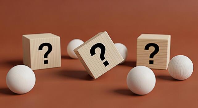 Wooden blocks displaying question marks amidst white spheres on a brown surface symbolizing uncertainty and the search for answers in a minimalist and thoughtprovoking composition photo