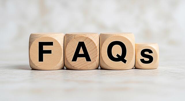 Wooden blocks displaying FAQs on a neutral surface representing information and customer support creating a clear and accessible resource for users with common questions and answers in a simple format photo