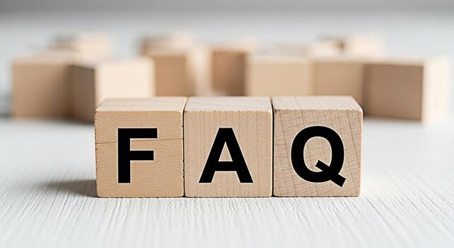 Wooden blocks spelling FAQ on a white wooden surface representing frequently asked questions and information creating a clear and helpful atmosphere for customer service and support resources online photo