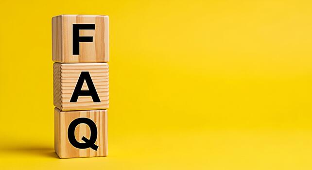 Wooden blocks displaying FAQ on a bright yellow background representing frequently asked questions and providing clarity guidance and support for customers seeking information and solutions photo
