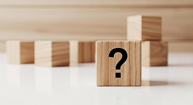 Wooden cube displaying a question mark on a white surface symbolizing uncertainty and the search for answers in a minimalist and conceptual setting evoking curiosity and problemsolving photo