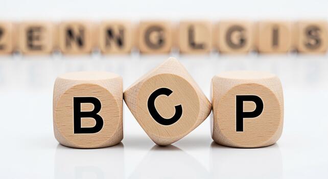 Wooden dice displaying BCP letters on a white surface representing Business Continuity Planning creating a sense of preparedness and strategic foresight in a corporate environment photo
